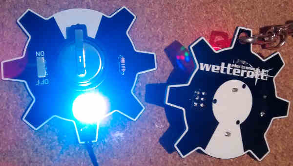 Completed OSHW-RGB-Badge kit, showing LED on front and layout on reverse