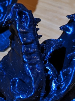 photo 3d print close up of dragon head showing print layers