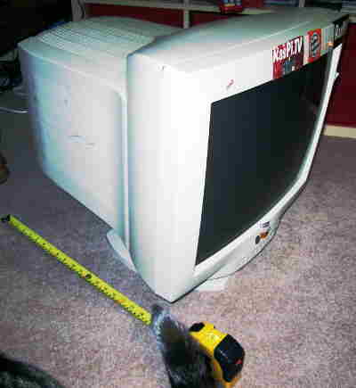 Old, huge, CRT monitor adorned with Raspberry Pi stickers