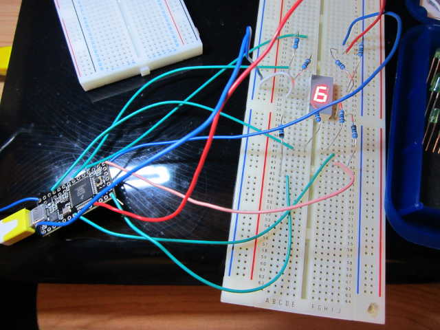 an eight segment led showing a '6' on a bread board powered by a Teensy 3.0